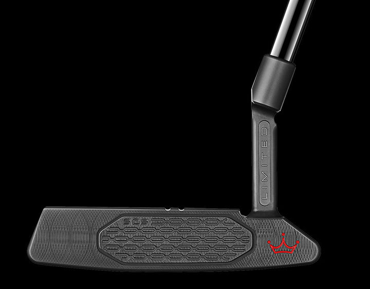 Scotty Cameron Black Odyssey Putter with Red Accents and Textured Grip