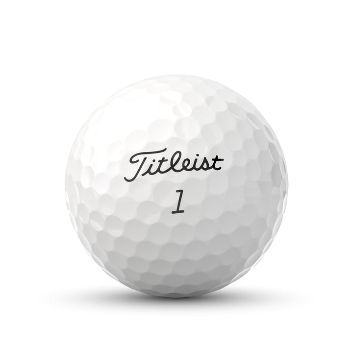 White titleist golf ball with dimpled surface and number 1 on it.