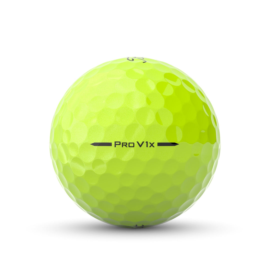 Yellow golf ball with dimpled surface, pro v1x model by titleist.