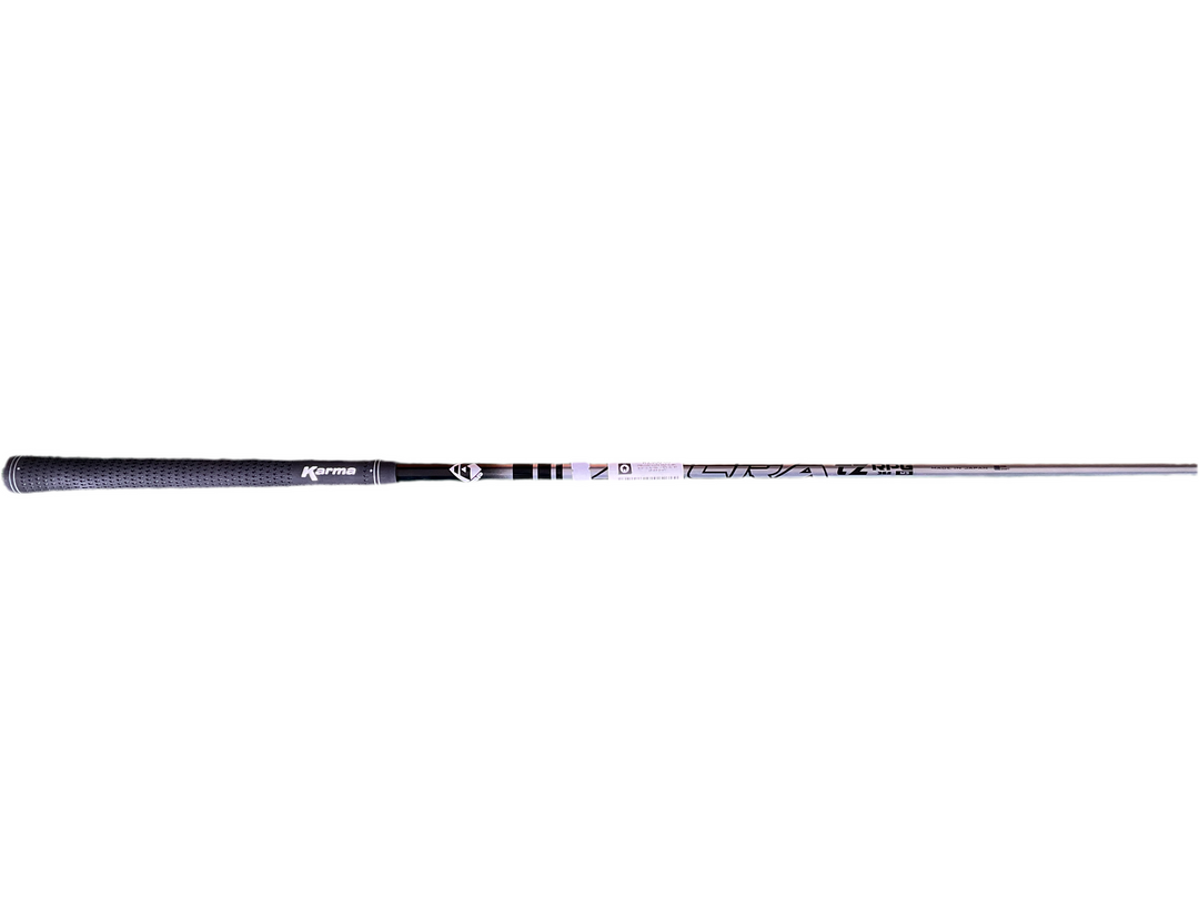 Black and white golf club with textured grip, featuring a popular brand logo.