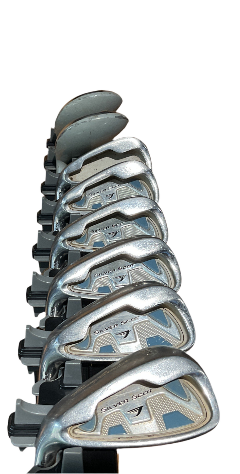 Silver taylormade golf iron set with blue accents and sleek design.
