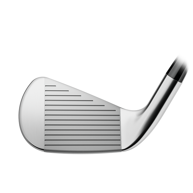 Silver golf club head with black tip and grooves for spin control.
