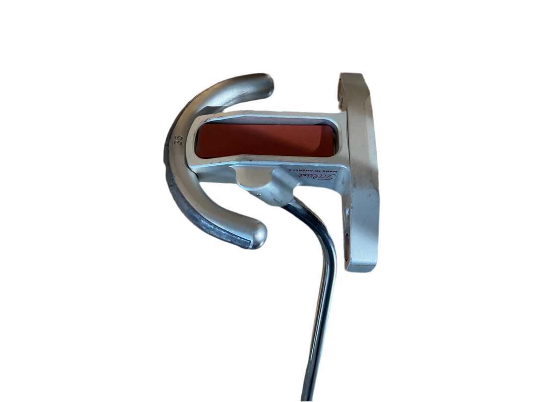 Silver and red putter golf club head with a unique horseshoe design, likely from scotty cameron.