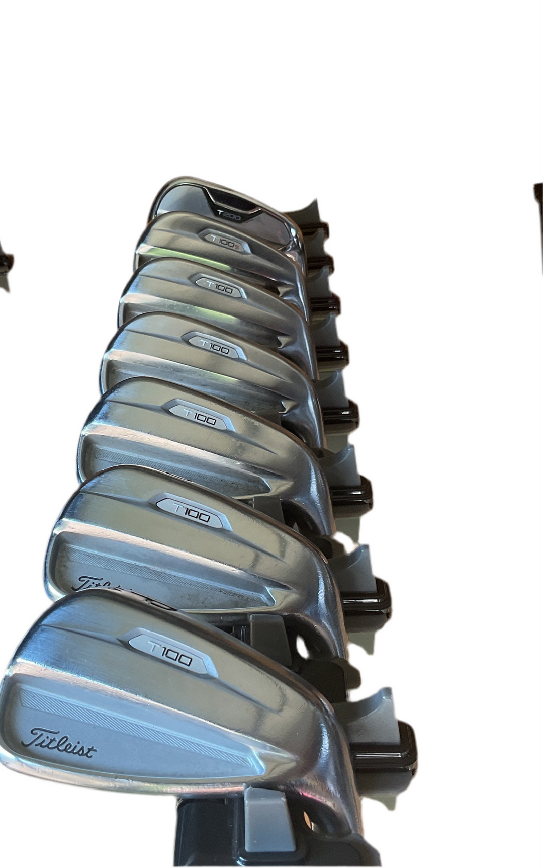 Silver titleist golf iron set with black accents and sleek design.