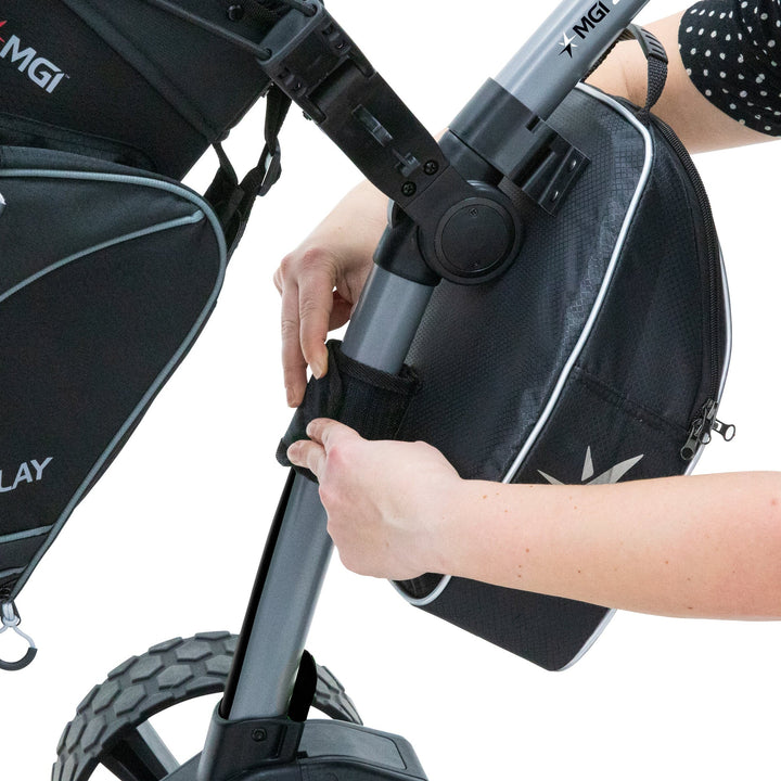Black stroller bag with silver accents and mgi logo.