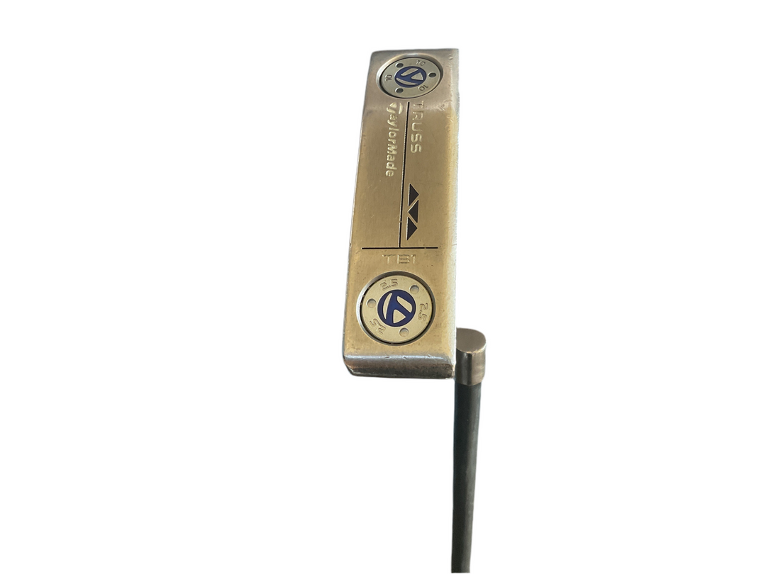 Gold-colored putter with black shaft and silver accents, featuring a sleek design.
