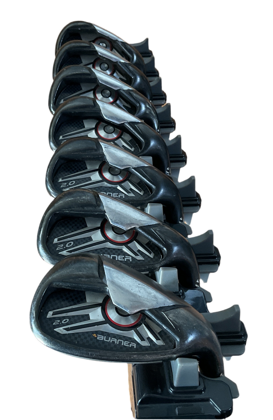 Black and silver inline skate blades with adjustable bindings.