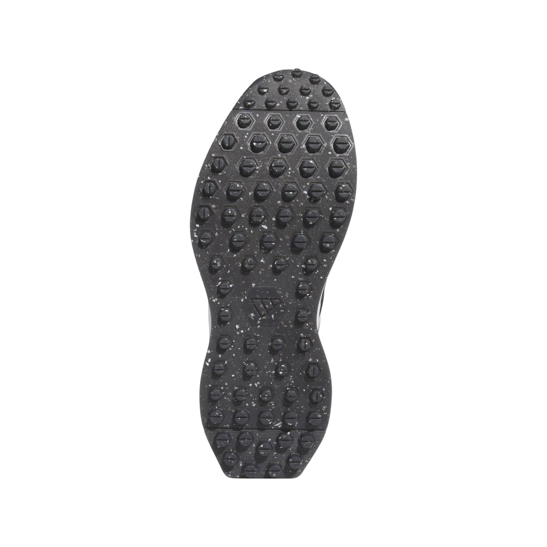 Black adidas golf spike shoe sole with textured pattern and speckled design.