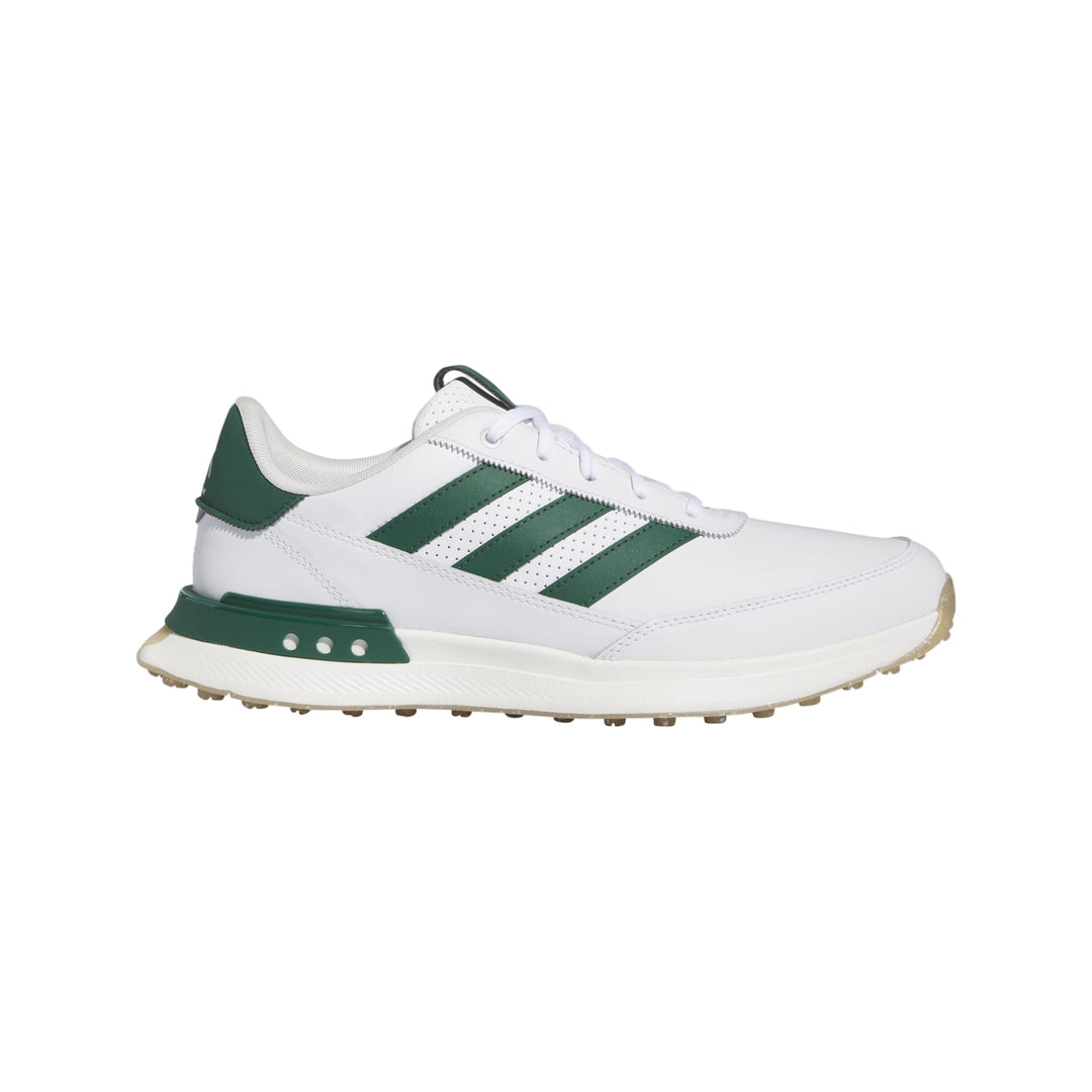 White and green adidas golf shoe with textured sole.