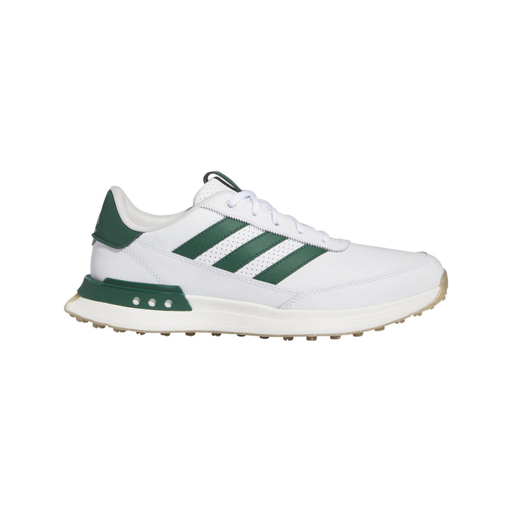 White and green adidas golf shoe with textured sole.