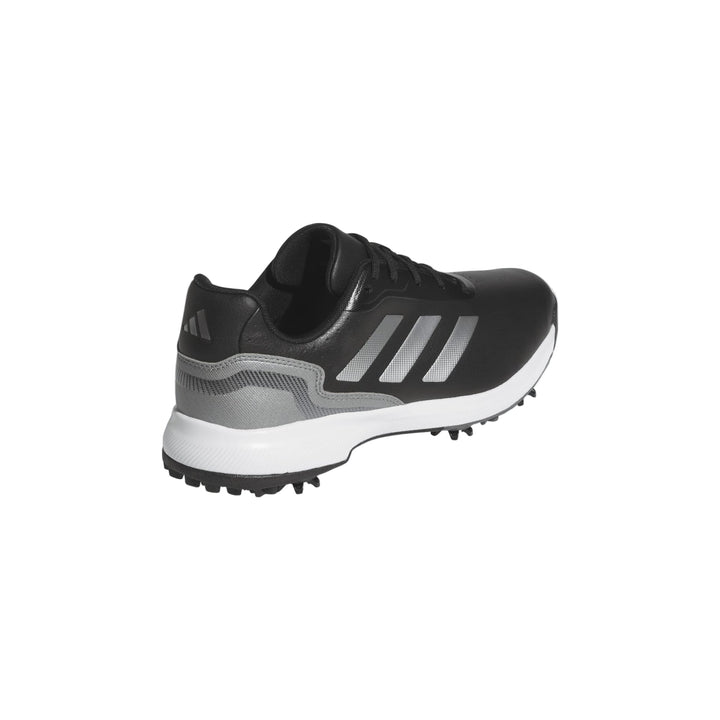 Black and silver adidas golf shoe with spike design.