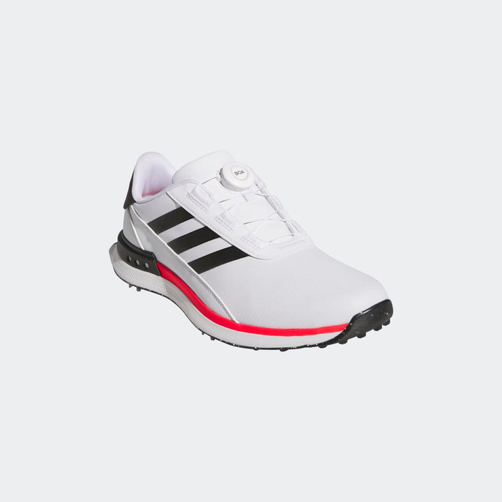 Adidas white and black golf shoe with red accents.