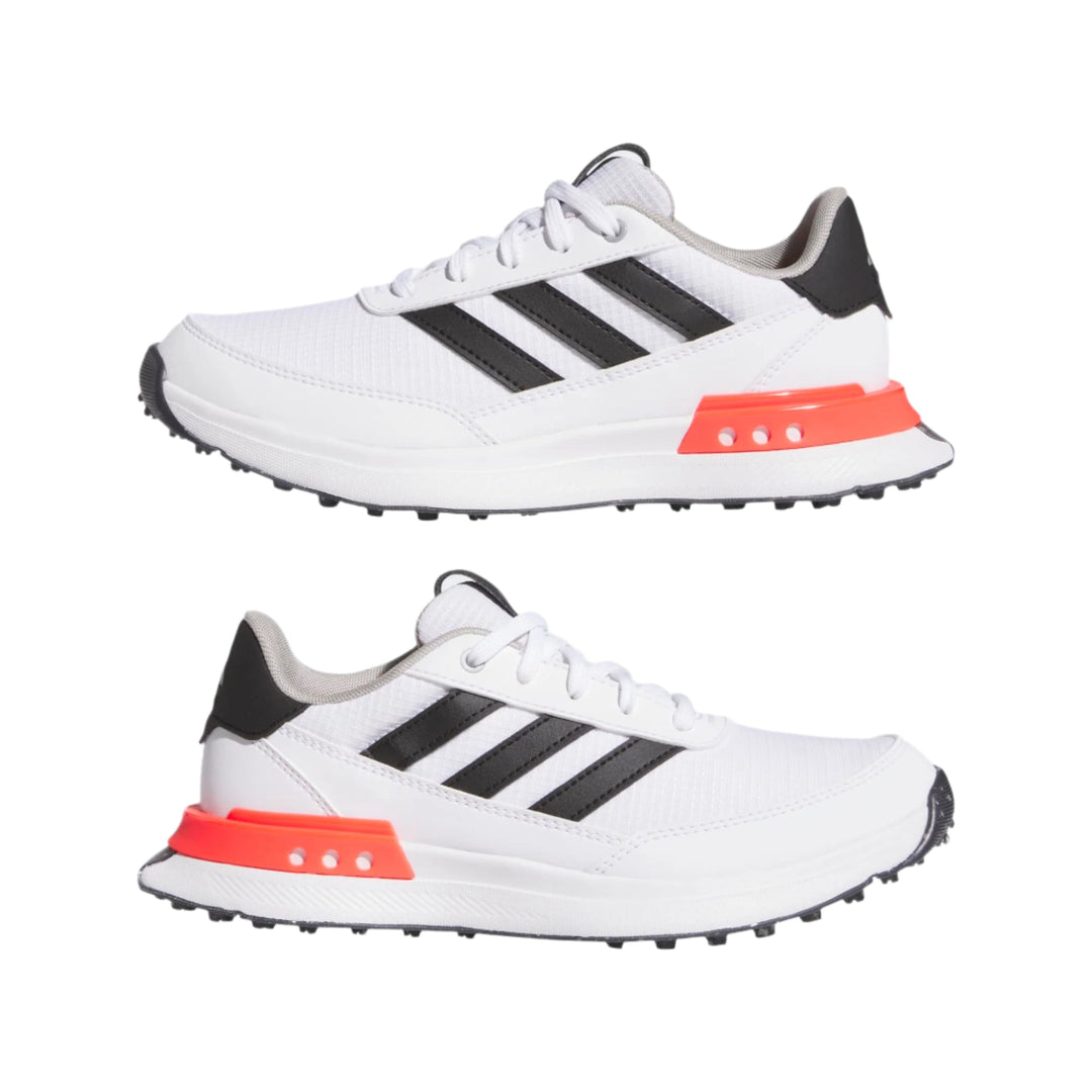 Adidas white and black golf shoe with orange accents.