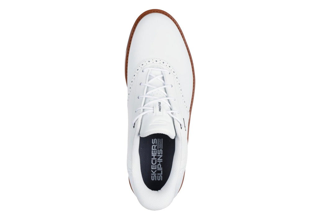 White leather skechers shoe with perforated toe and brown stitching.