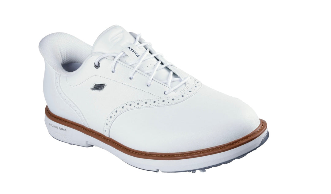 White leather golf shoe with brogue detailing and rubber sole.