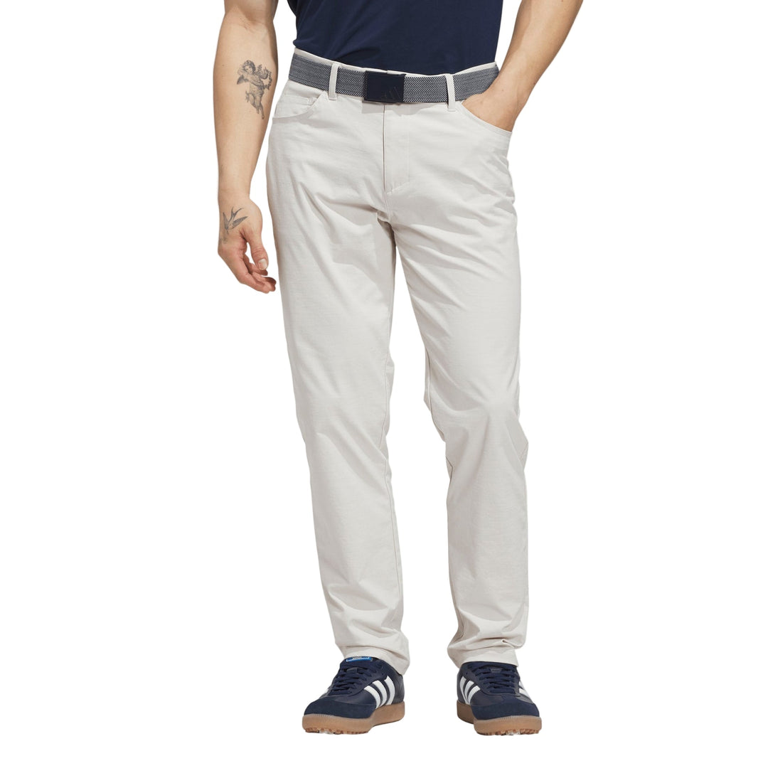 Light gray golf pants with a belt loop and elastic waistband, likely made of polyester or cotton blend.