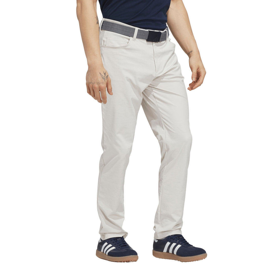 Light gray golf pants with belt loops and elastic waistband, likely made of cotton or polyester blend.