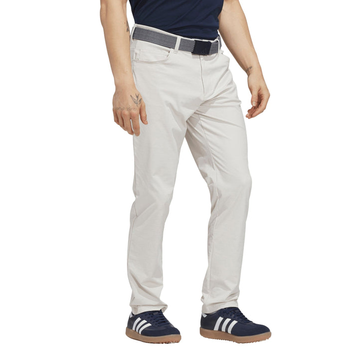 Light gray golf pants with belt loops and elastic waistband, likely made of cotton or polyester blend.
