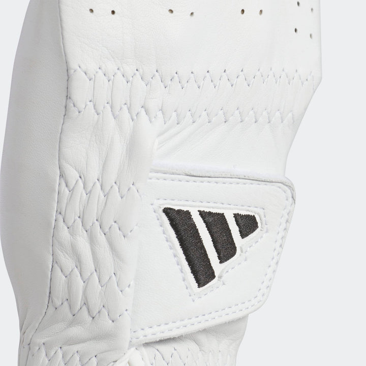 White leather adidas baseball glove with black logo and stitching.