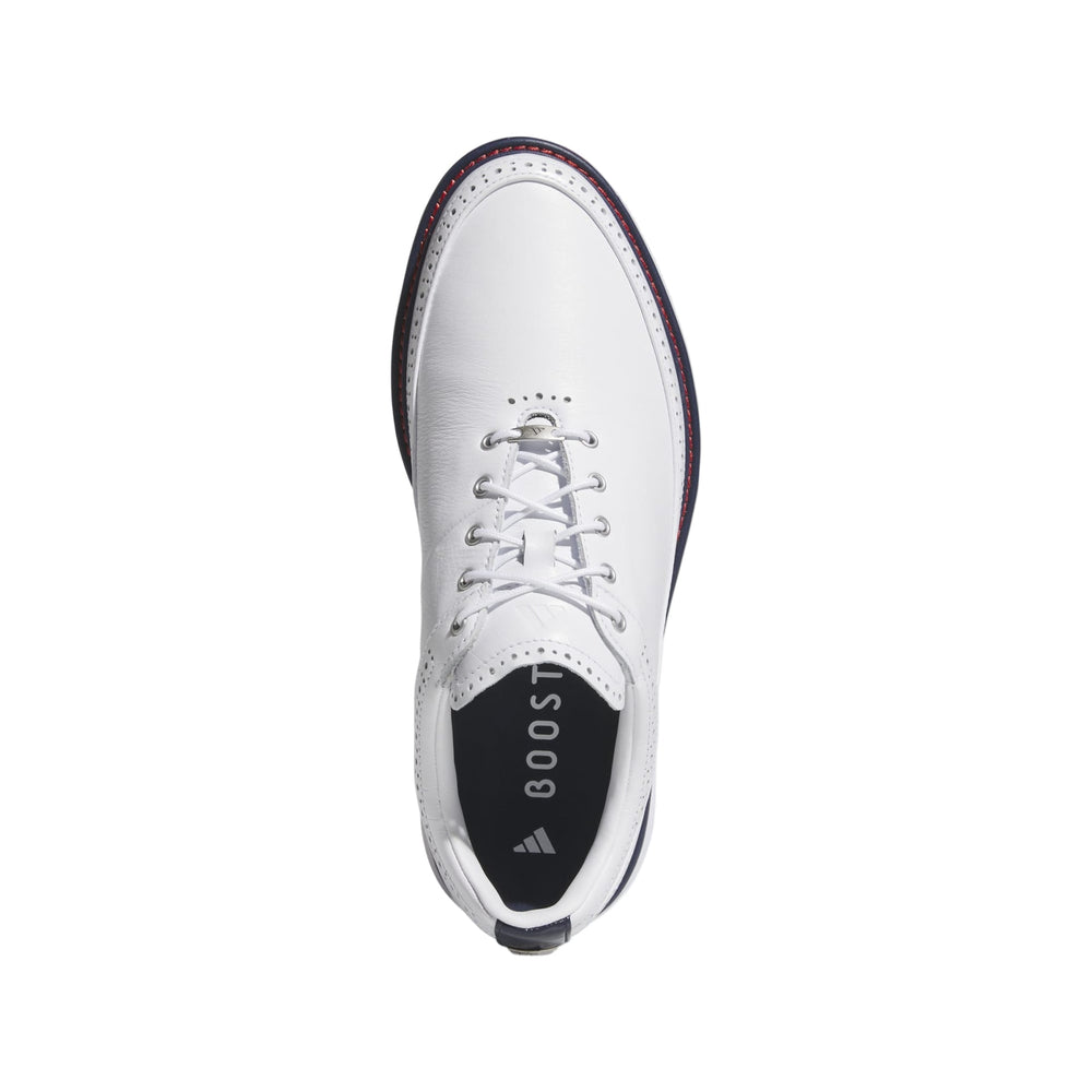 White leather golf shoe with boost cushioning and laces.