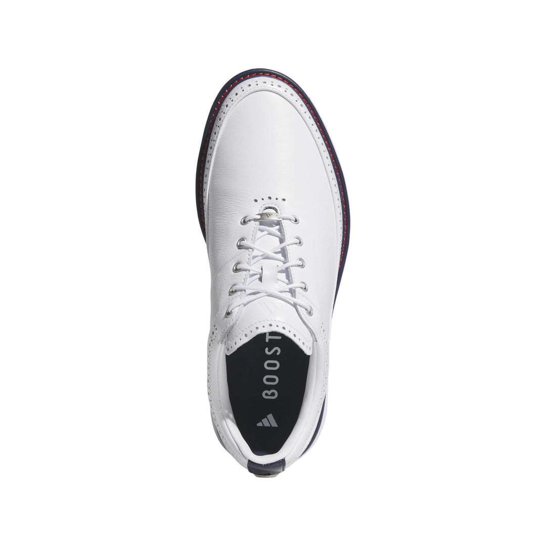 White leather golf shoe with boost cushioning and laces.