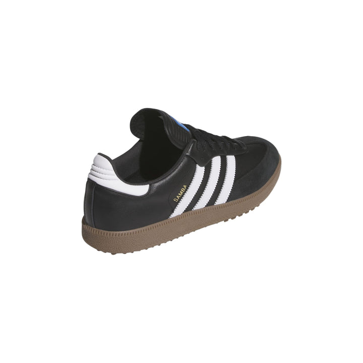 Black and white adidas samba shoe with gum sole.