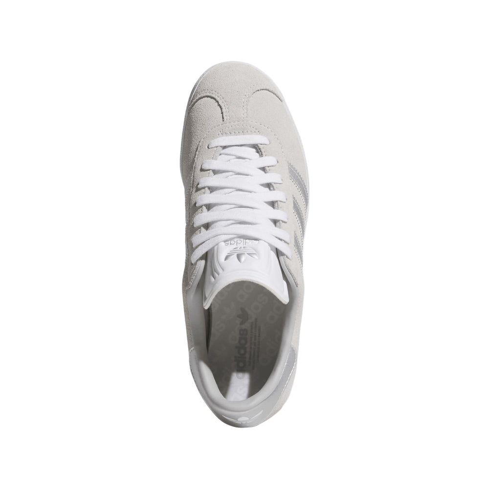 White leather sneaker with classic design and adidas logo.