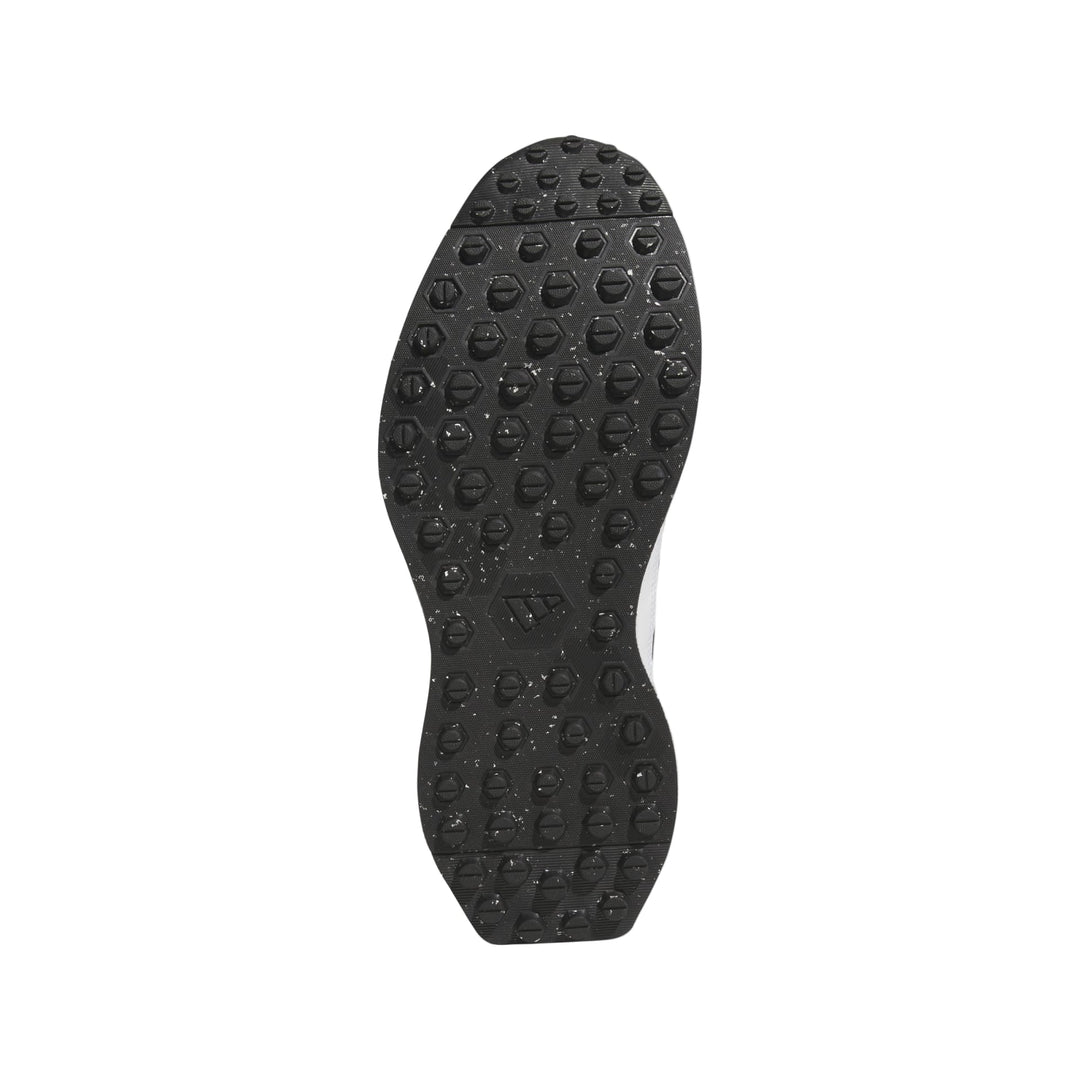 Black textured sole of a sneaker with white accents and adidas branding.