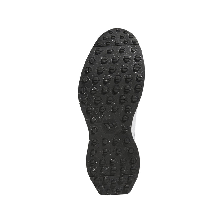 Black textured sole of a sneaker with white accents and adidas branding.
