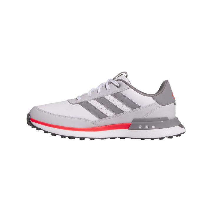 Adidas golf shoe with white and gray upper, red sole, and textured rubber outsole.