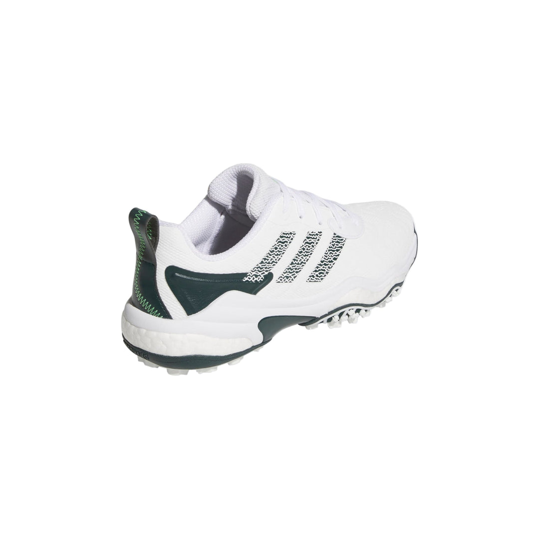 White and green adidas golf shoe with spikes.