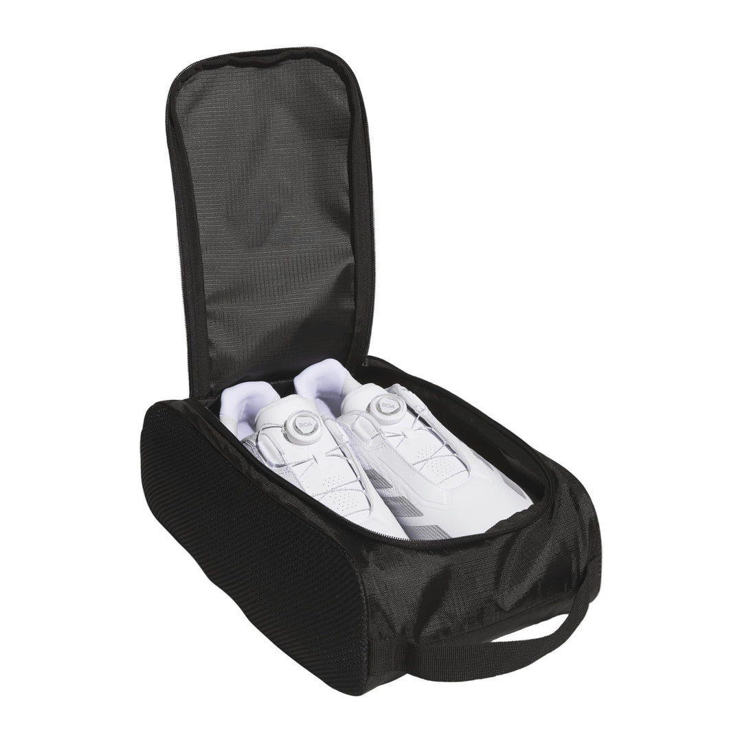 Black shoe bag with mesh pocket and white sneakers inside.