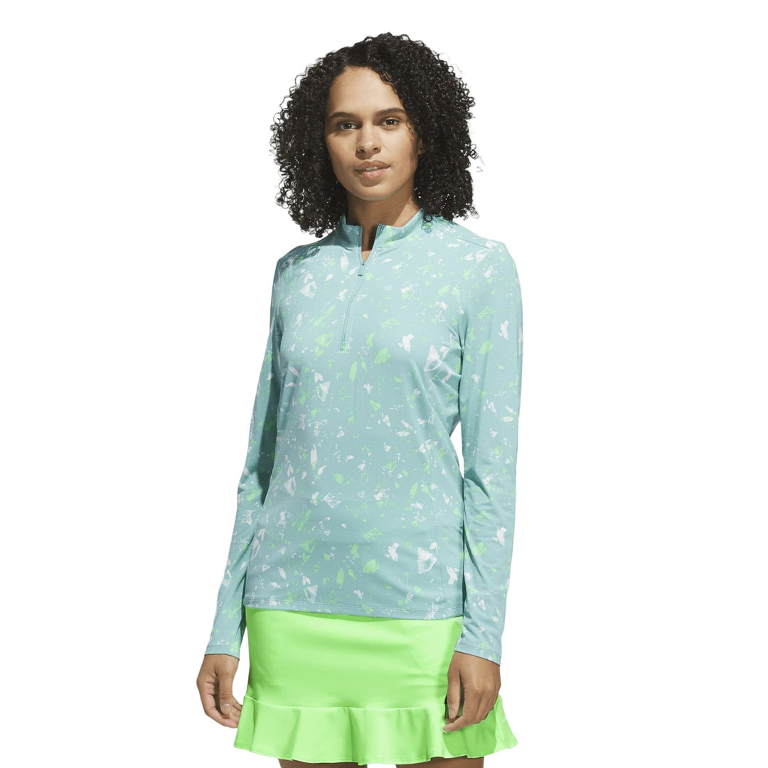 Light blue and green nike golf pullover with a quarter zip design.