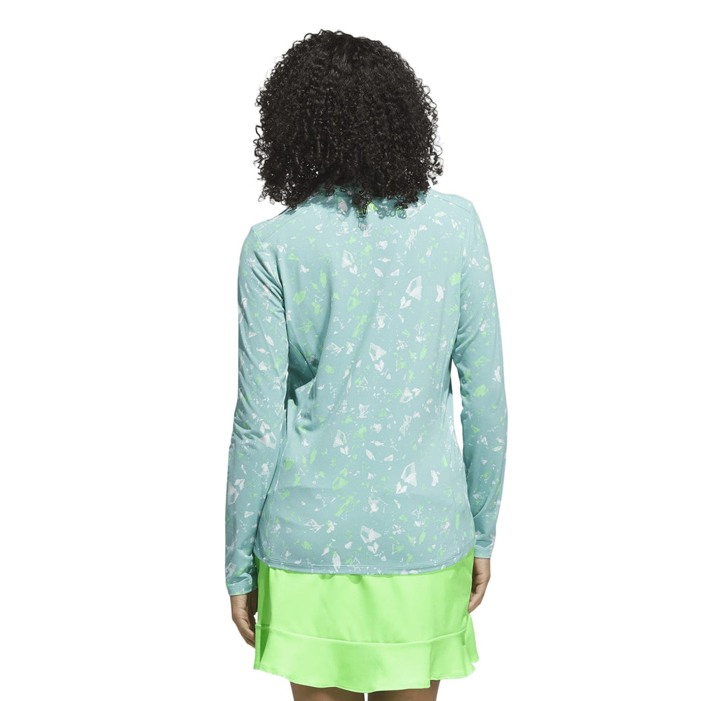 Mint green floral print long-sleeve top with a lace trim at the neckline and hem.