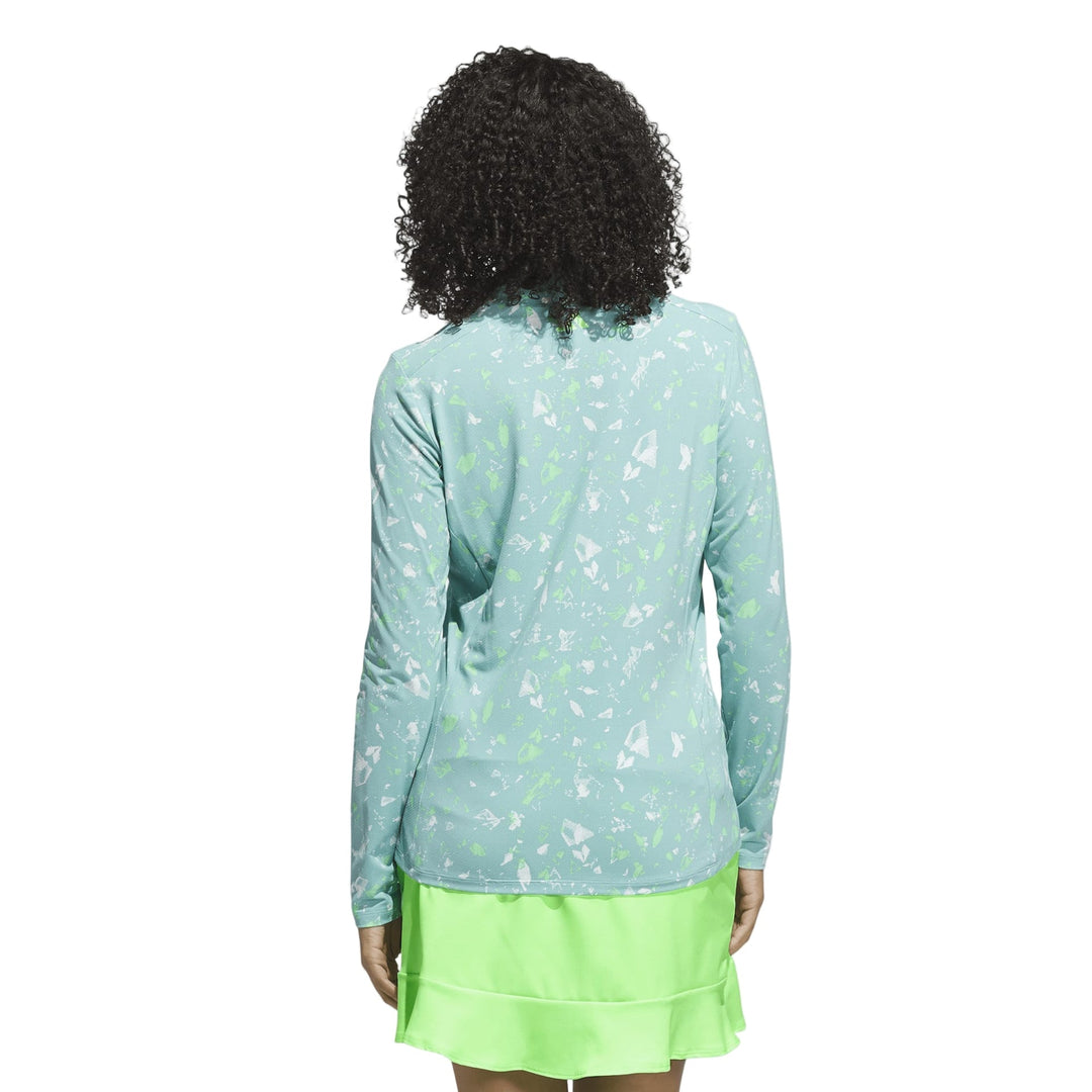 Mint green floral print long-sleeve top with a lace trim at the neckline and hem.