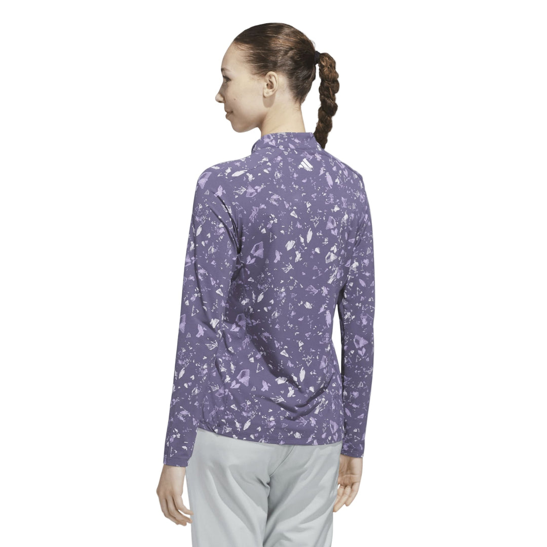 Lavender floral print zip-up jacket with a high collar and long sleeves.