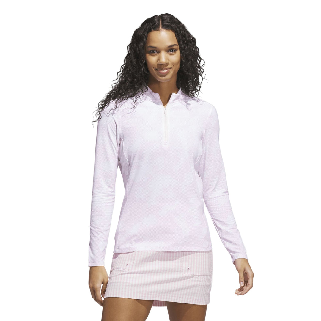 White long-sleeved pullover with zipper detail and ribbed skirt.