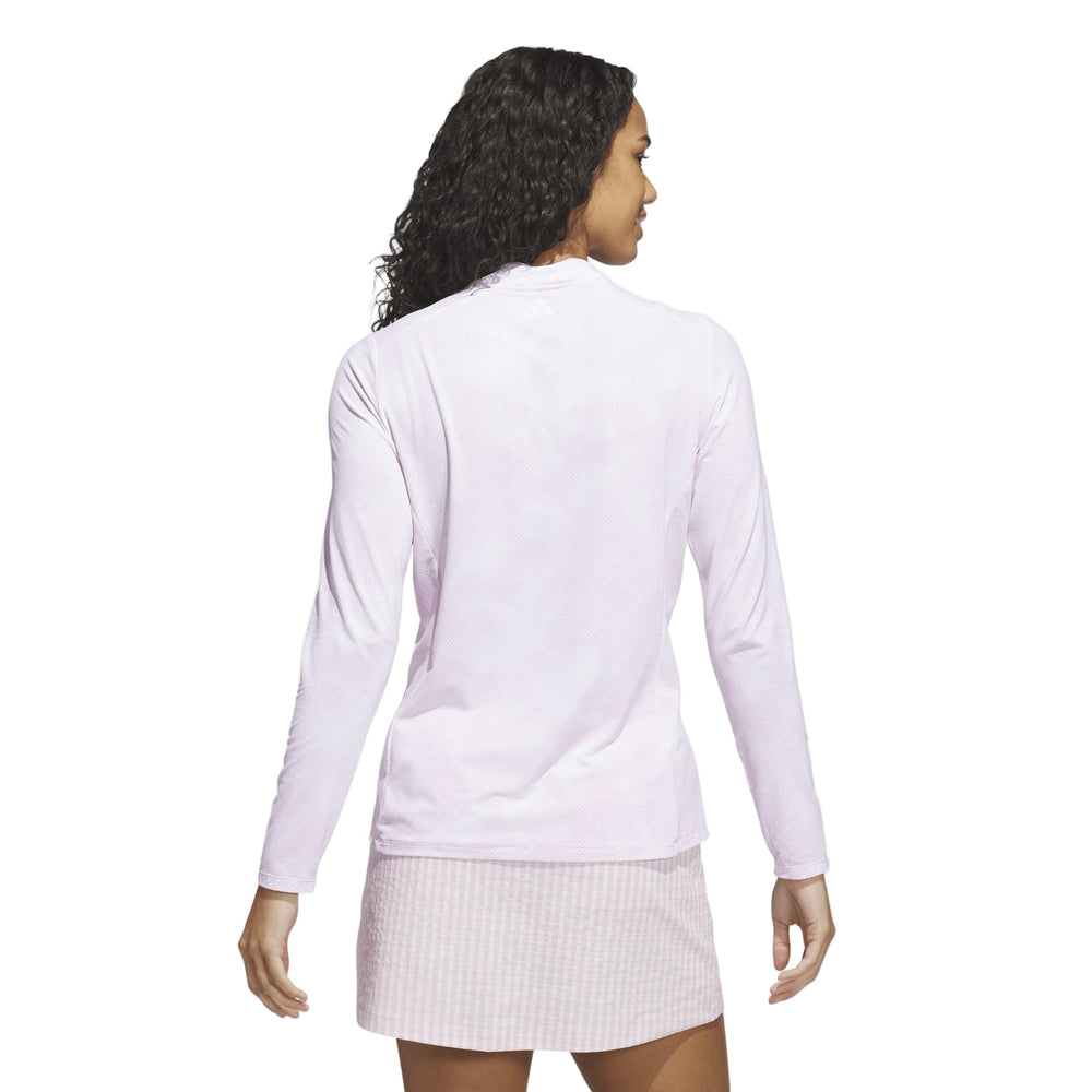 Lavender long-sleeve tennis dress with ribbed skirt and nike logo on back.