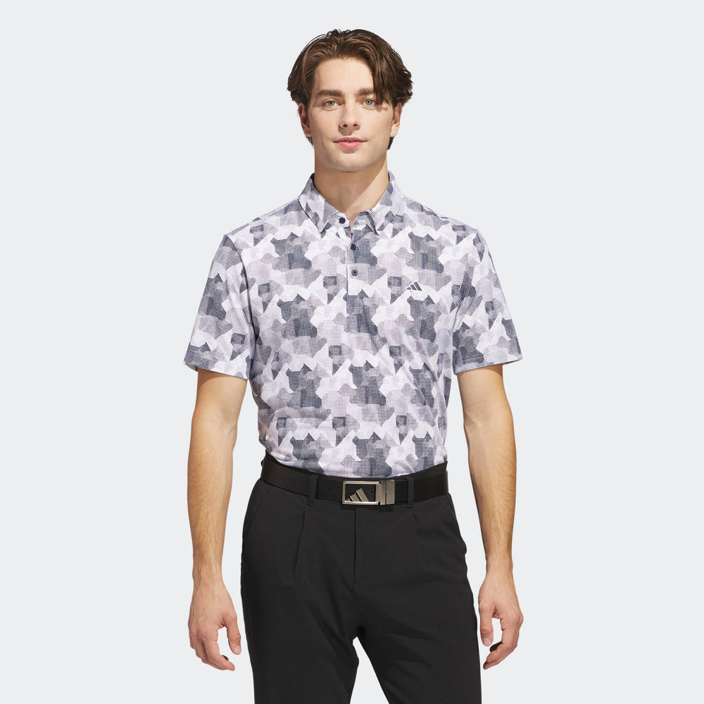 White and black patterned golf shirt with short sleeves, made of polyester material.