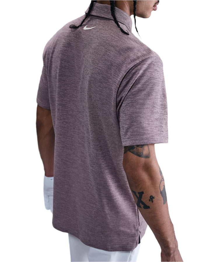 Nike men’s short-sleeve polo shirt in dark purple with a subtle pattern and logo on the chest.