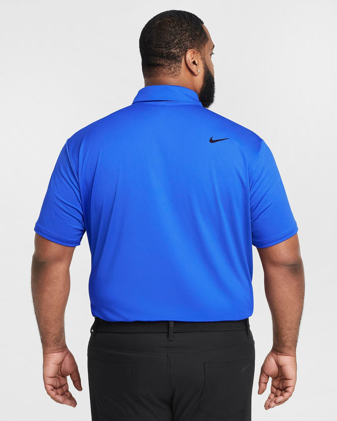Royal blue nike golf polo shirt with small swoosh logo on the back.