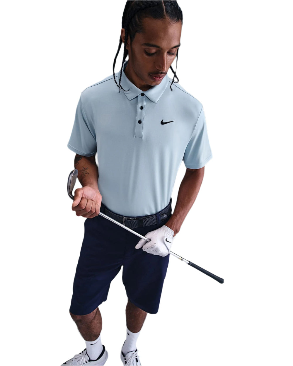 Nike golf polo shirt with black swoosh, light blue color.