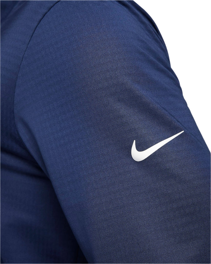 Nike blue jacket with white swoosh logo.