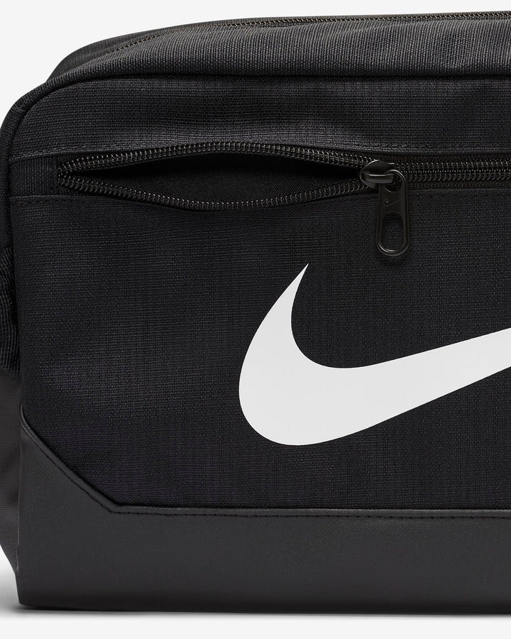Black nike shoe bag with white swoosh logo and zipper closure.