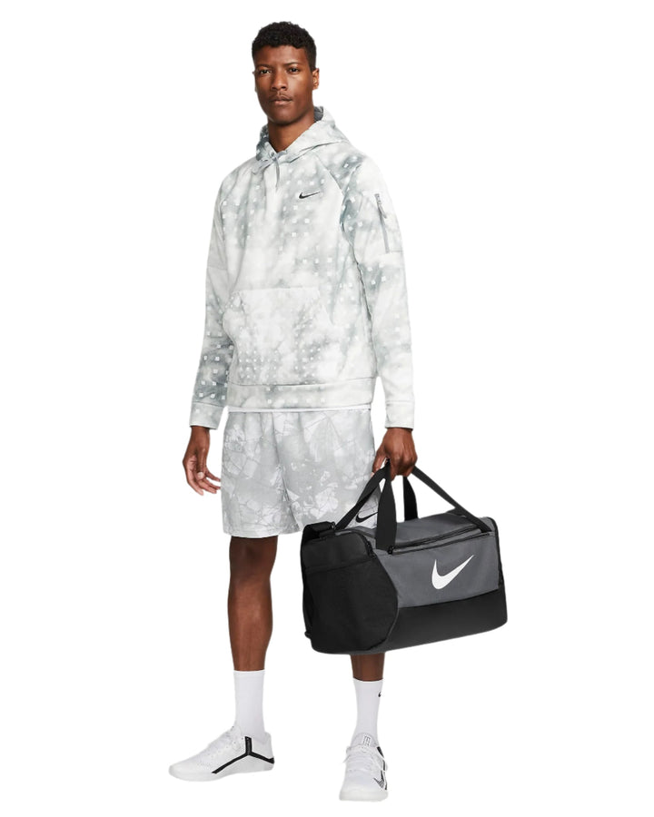 Black and white nike duffel bag with swoosh logo.