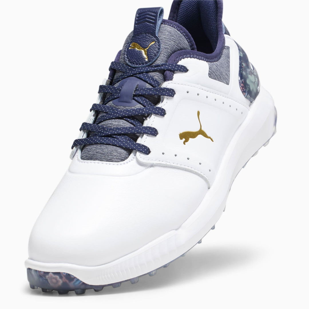 White and navy blue puma golf shoe with gold accents, textured upper material, lace-up design.