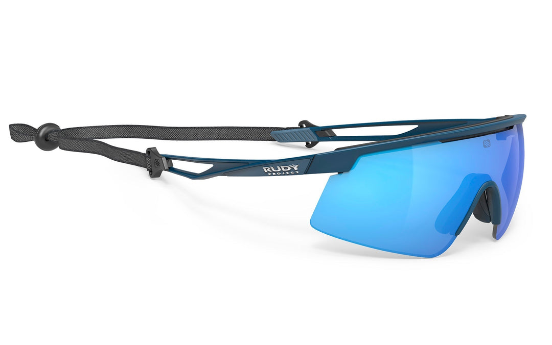 Blue and black rudy project tralyx+ sunglasses with interchangeable lenses.