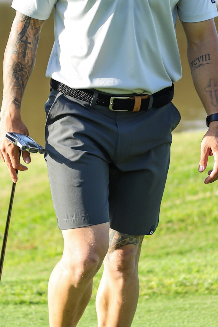 Gray golf shorts with black belt and buckle, likely made of polyester or cotton blend.