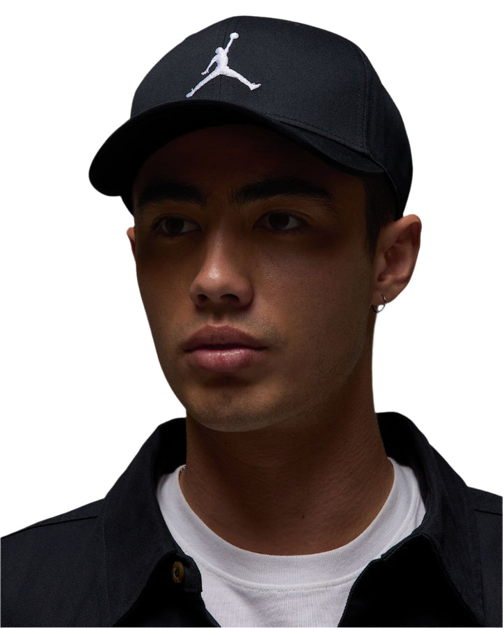 Black jordan cap with white logo.