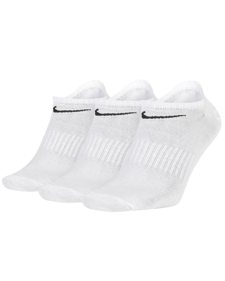 White nike athletic socks with black swoosh design and textured material for grip.